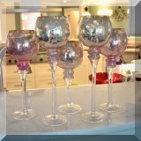 G05. Tall glass candleholders. 